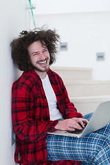 Image showing freelancer in bathrobe working from home