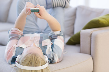 Image showing girl enjoying music through headphones