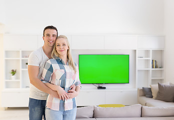 Image showing couple hugging in their new home