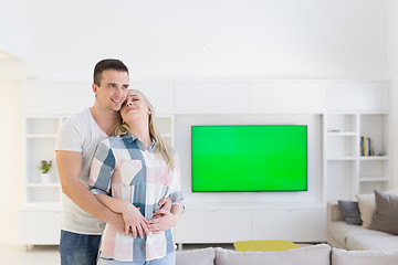 Image showing couple hugging in their new home