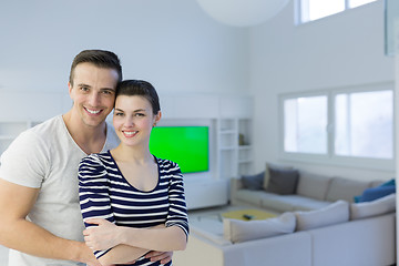 Image showing couple hugging in their new home