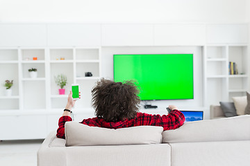 Image showing young man in bathrobe enjoying free time