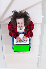 Image showing freelancer in bathrobe working from home