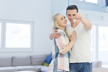 Image showing couple showing a keys of their new house