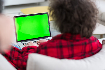 Image showing man freelancer in bathrobe working from home