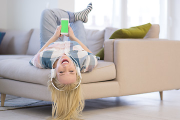 Image showing girl enjoying music through headphones