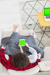 Image showing couple relaxing at  home with tablet computers