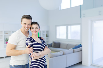 Image showing couple hugging in their new home