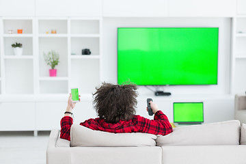 Image showing young man in bathrobe enjoying free time