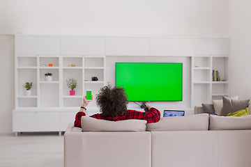 Image showing young man in bathrobe enjoying free time