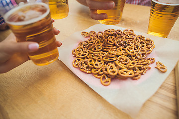 Image showing beer and pretzels. Perfect for Octoberfest. Natural wooden background.