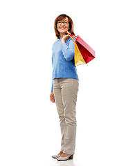 Image showing senior woman with shopping bags isolated on white