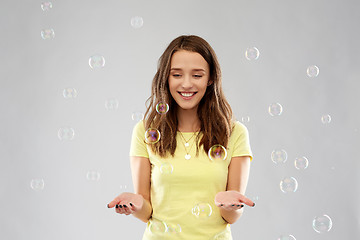 Image showing young woman or teenage gir with soap bubbles