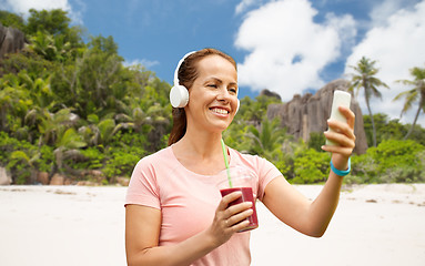 Image showing woman with smartphone and shake listening to music