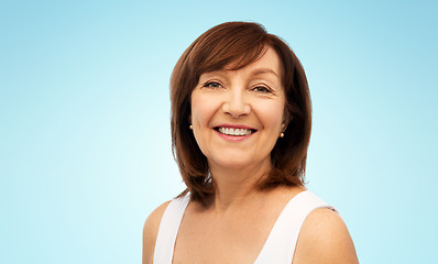 Image showing portrait of smiling senior woman over white