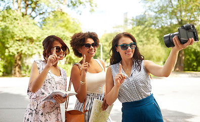 Image showing women with map travelling and recording video blog