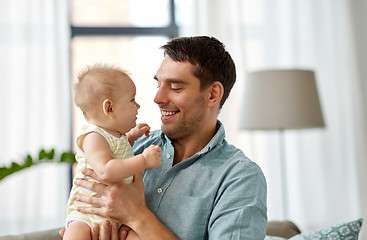 Image showing father with little baby daughter at home