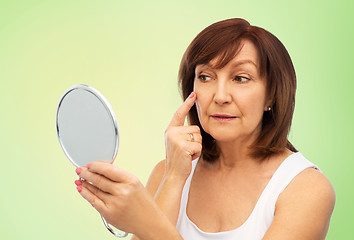 Image showing portrait of smiling senior woman with mirror