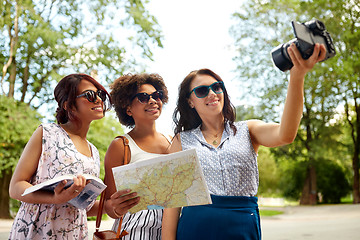 Image showing women with map travelling and recording video blog