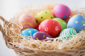 Image showing close up of colored easter eggs in basket