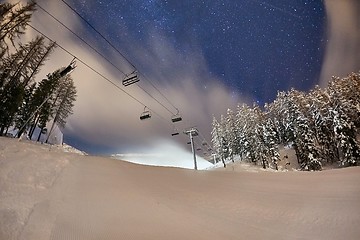 Image showing Ski lift at night under the stars in the sky