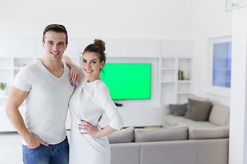 Image showing couple hugging in their new home