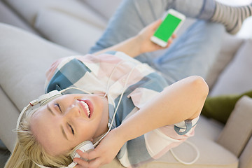 Image showing girl enjoying music through headphones