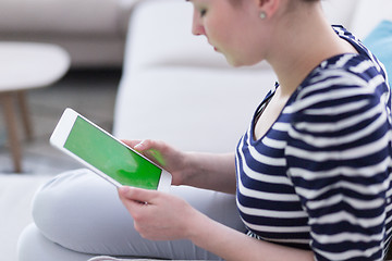 Image showing woman on sofa using tablet computer