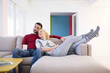 Image showing couple hugging and relaxing on sofa