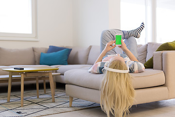 Image showing girl enjoying music through headphones