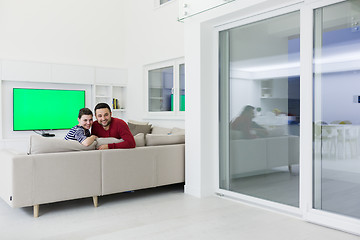 Image showing couple hugging and relaxing on sofa