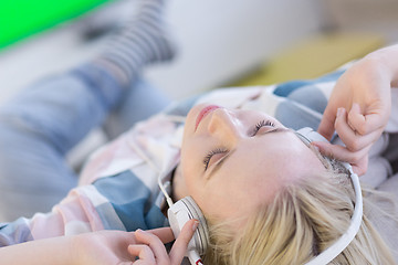 Image showing girl enjoying music through headphones