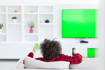 Image showing young man in bathrobe enjoying free time