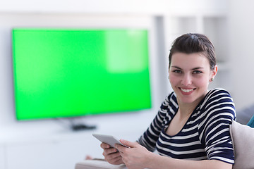 Image showing woman on sofa using tablet computer