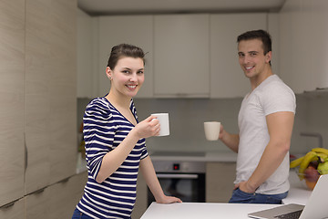 Image showing couple with laptop computer enjoying morning