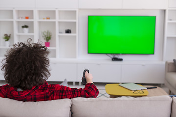 Image showing young man in bathrobe enjoying free time