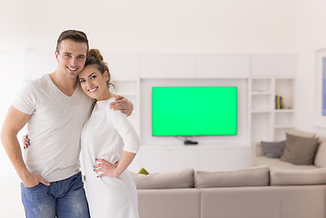 Image showing couple hugging in their new home