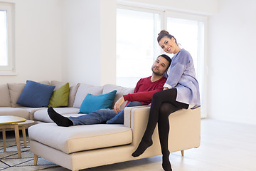 Image showing couple hugging and relaxing on sofa