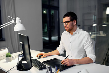 Image showing designer with computer and pen tablet at office