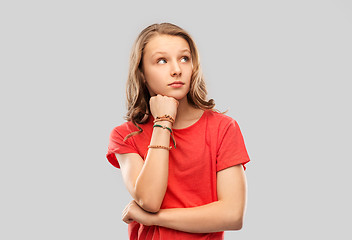 Image showing teenage girl in red t-shirt with bangles on arm