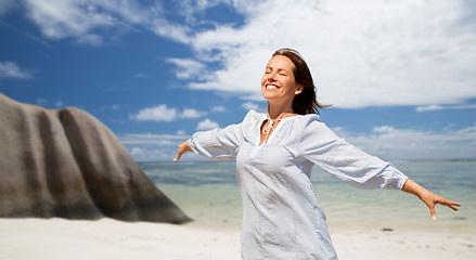 Image showing happy woman over seychelles island tropical beach