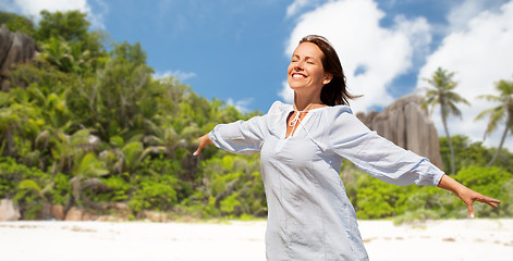 Image showing happy woman over seychelles island tropical beach