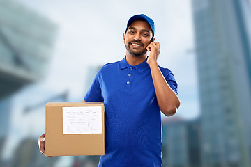 Image showing indian delivery man with smartphone and parcel box