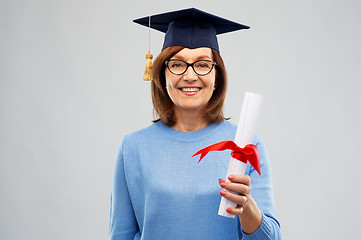 Image showing happy senior graduate student woman with diploma