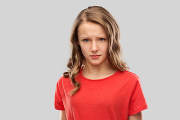 Image showing sad or angry teenage girl in red t-shirt