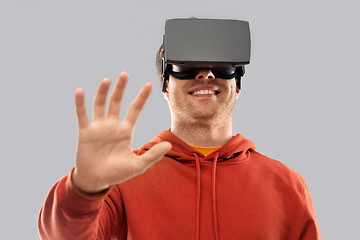 Image showing happy man in virtual reality headset or vr glasses