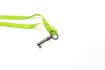 Image showing Vintage silver key with green ribbon