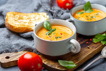 Image showing Delicious tomato soup with spices and herbs.