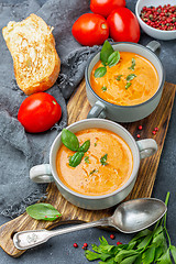 Image showing Tomato soup with cream and basil.