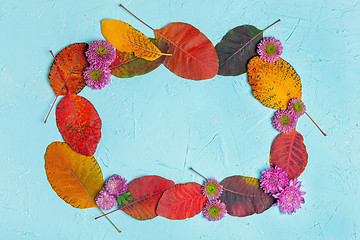 Image showing Frame of autumn leaves and flowers.